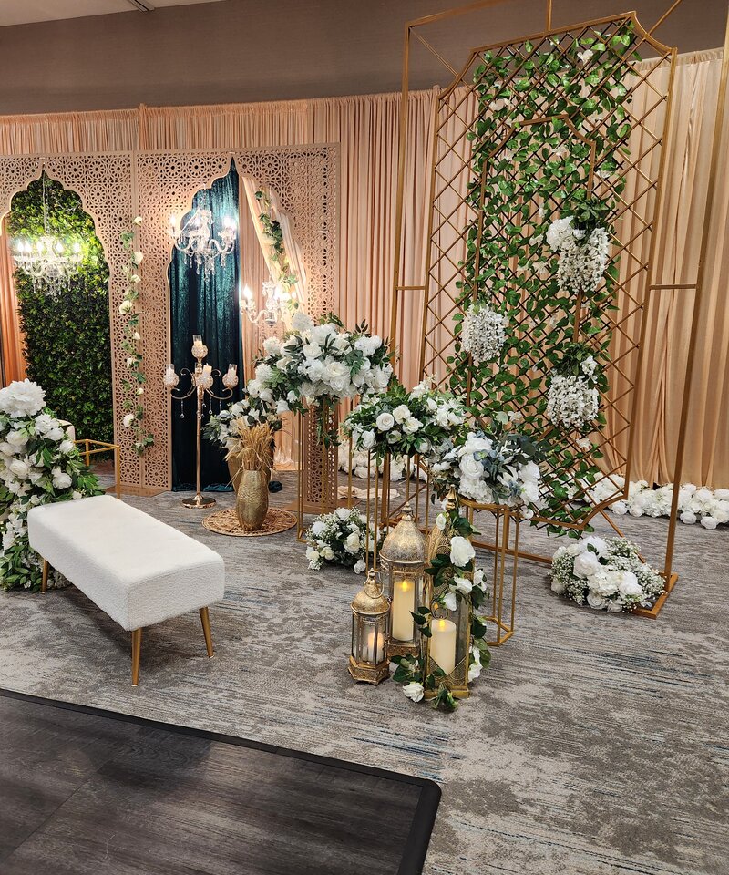 Grand Nikkah stage with Moorish arches emerald velvet gold trellis white florals Ohio