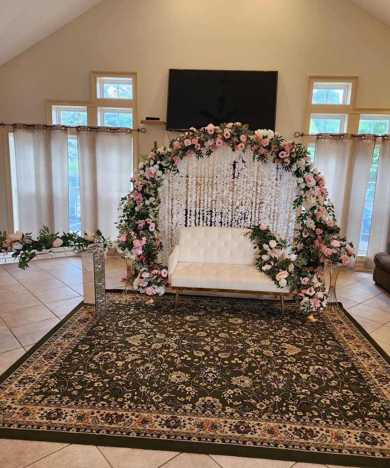 Circular floral arch with blush roses and wisteria backdrop garden wedding Columbus Ohio