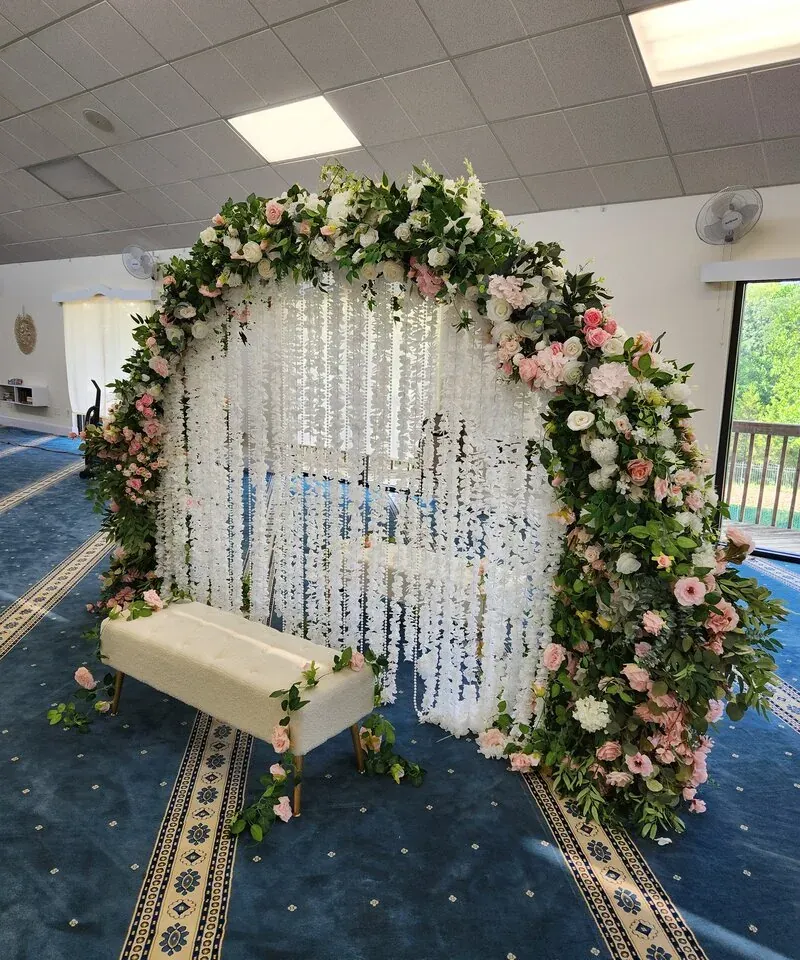 Floral Nikkah arch with white wisteria inside a mosque by Events By Maryam
