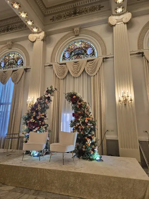 Crescent floral arch stage with columns